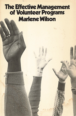 Book cover with hands raised
